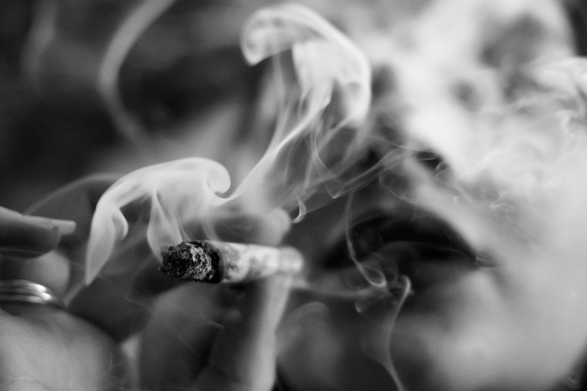woman smoking.jpg Photo by Dimitri Bong on Unsplash