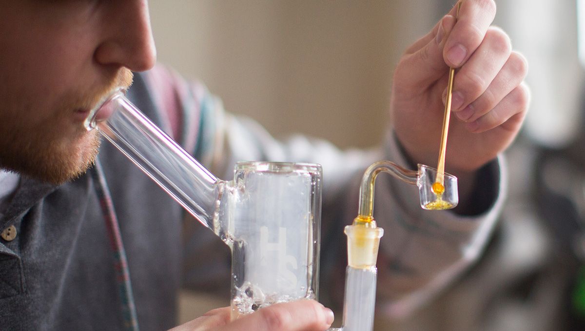 Cannabis Shatter: What Is It, How To Make And Smoke THC & CBD Hash Oil: A cropped photo of a young man dabbing shatter Cannabis Shatter: What Is It, How To Make And Smoke THC & CBD Hash Oil: A cropped photo of a young man dabbing shatter