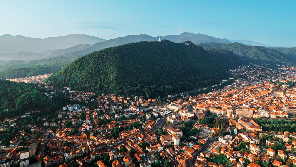 Weed in Romania: Cannabis Legal Status Guide: A bird's eye view of a city in a mountain valley